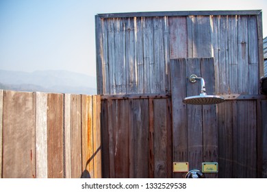 Outdoor Shower With A Large Shower In The Bathroom Made From Wooden Wall For Tourists To Steep A Shower After The Tour.