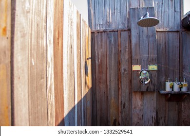 Outdoor Shower With A Large Shower And Shampoo Cream In The Bathroom Made From Wooden Wall For Tourists To Steep A Shower After The Tour.