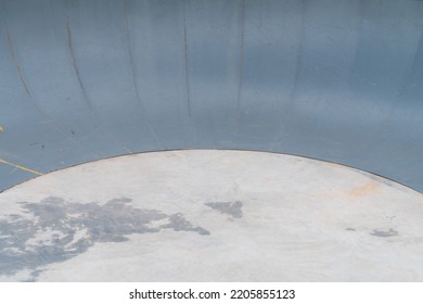 Outdoor Skatepark With Blue Sky And Grey Concrete