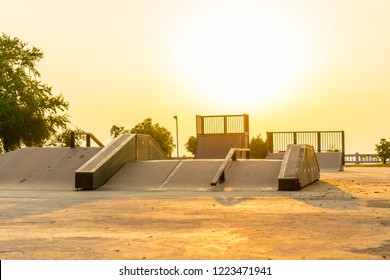 Outdoor Skatepark With Various Ramps On Sunset Time