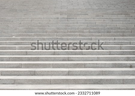 The outdoor staircase made of gray marble stone looks like a pattern.
