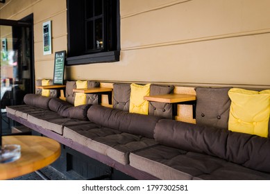 Outdoor Street Cafe Exterior.  No People. Comfortable Sofa With Tables  Cafe Exterior.