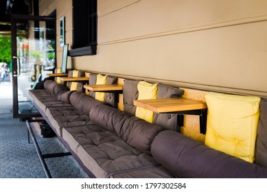 Outdoor Street Cafe Exterior.  No People. Comfortable Sofa With Tables  Cafe Exterior.