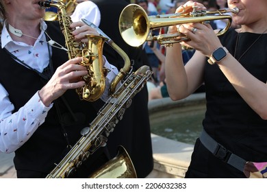 Outdoor Street Musicians Entertaining The Crowd In Summer.Background Image Of A Jazz Band