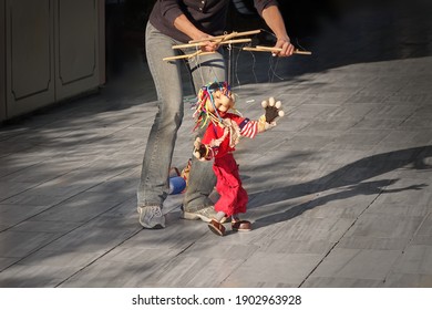 Outdoor Street Performance With  Puppet. Women Dance With Her Puppet. - Powered by Shutterstock