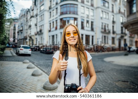 Similar – Long hair girl with hat and sunglasses walking in Sydney city streets in Australia.