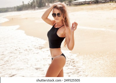 Outdoor Summer Sunny Fashion Portrait Of Pretty Young Sensual Blonde Woman Posing In Bikini On The Beach And Have Fun Alone 