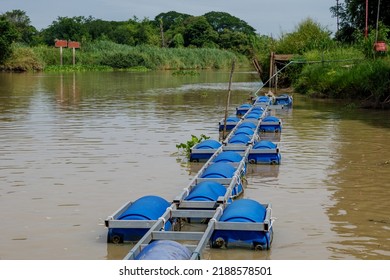 Outdoor sunny view of Floating buoyancy on Chao Phraya River and background of countryside in Thailand. - Shutterstock ID 2188578501