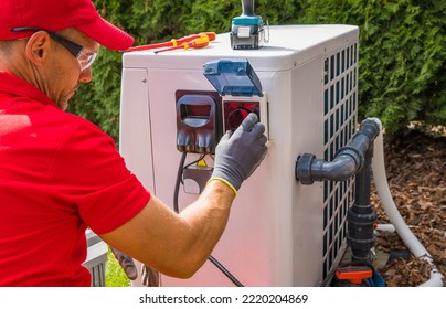 Outdoor Swimming Pool Heat Pump Maintenance Performed by Professional Pools Specialist. Caucasian Male in His 40s. - Powered by Shutterstock