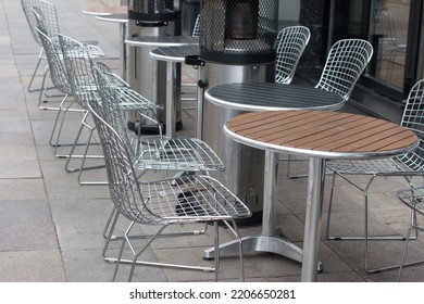 Outdoor Tables In A Restaurant With A Warm Heater. Cafe Summer Veranda