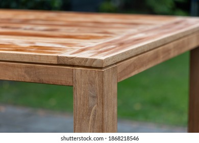 Outdoor Teak Dining Table In The Garden