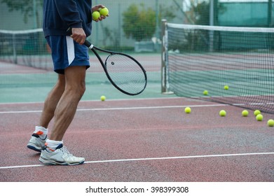 Outdoor Tennis Coach Ready For A Dribble