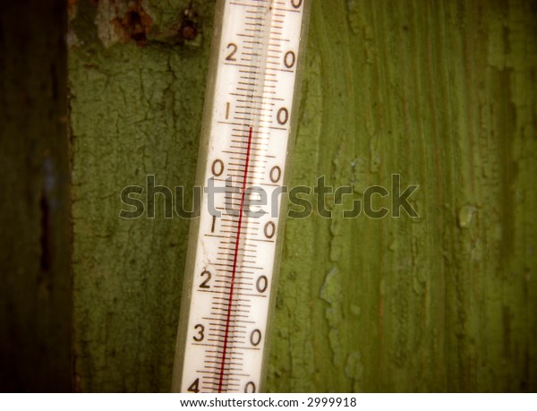 Outdoor\
thermometer. Old rickety\
thermometer.