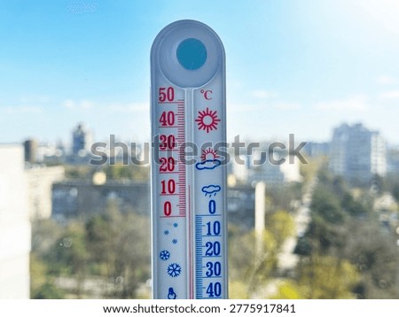 outdoor thermometer on window showing ten degrees above zero