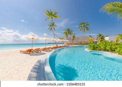 Outdoor tourism landscape. Luxurious beach resort with swimming pool and beach chairs or loungers under umbrellas with palm trees and blue sky. Summer travel and vacation background concept - Shutterstock ID 1506483155