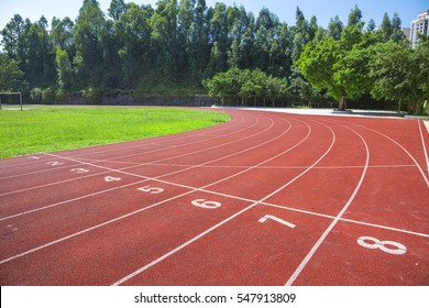 Outdoor Track And Field Stadium Runway Under The Blue Sky.