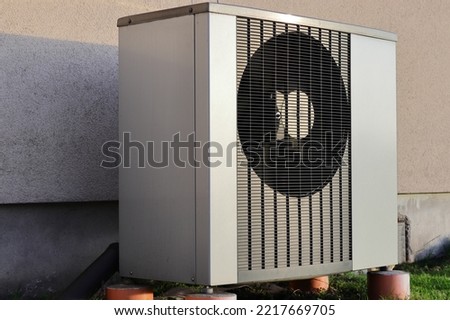 Outdoor unit air-water heat pump.
Fan grille. Heating of a family house.