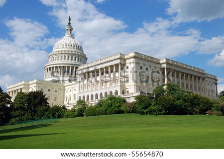 Outdoor view of US Capitol in Washington DC with beautiful blue sky in background