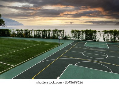 Outdoor Volleyball Court With A Net In The Morning Next To The Sea.