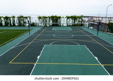 Outdoor Volleyball Court With A Net In The Morning Next To The Sea.