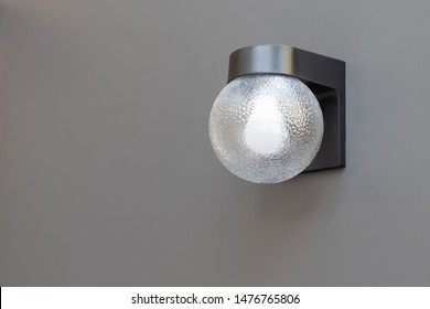 Outdoor Wall Lamp On Grey Concrete Panel. Exterior Lighting.