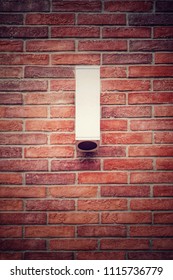 Outdoor Wall Light.lamp Hanging On The Weathered Brick Wall Background With Copy Space.

 