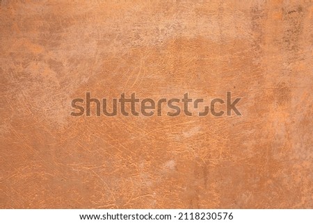 Outdoor wall with stripes. Background picture. Panted aged Concrete surface with terracotta plaster. Wallpaper textured picture. top view. 