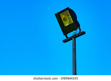 Outdoor Waterproof Floodlight On A Pole On Blue Sky Background