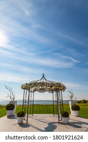 An Outdoor Wedding Altar By A Lake