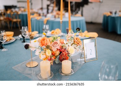 Outdoor wedding. Flower decoration of wedding tables. Banquet table setting and decoration. Cutlery on the table.