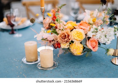 Outdoor wedding. Flower decoration of wedding tables. Banquet table setting and decoration. Cutlery on the table.