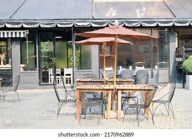 Outdoor café without people in summer in the old town.  - Shutterstock ID 2170962889