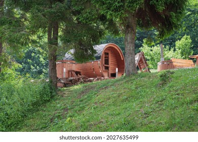 Outdoor Wooden Barrel Sauna In The Garden.