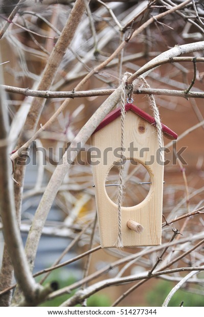 Outdoor Wooden Decoration Hanging On Branches Stock Image