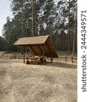 Outdoor wooden eating picnic shelter in a foreast  