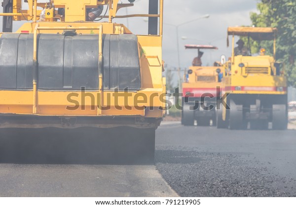 Outdoor working : Road roller working on the new\
road construction site in\
Thailand