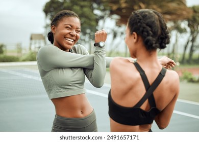 Outdoor, workout and happy women with stretching arms for morning exercise, wellness or fitness routine. Sports, athlete and friends for match, preparing or warm up muscles on tennis court in Chicago - Powered by Shutterstock