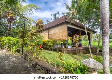 Outdoor Yoga Studio In Bali, Indonesia With Green Trees And Blue Skies