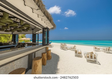 Outdoors beach bar with clear blue sea sky. Relaxing beachfront bar with chairs sun umbrellas. Luxury summer travel background. Freedom tropical sunny coast, summertime vibes pattern. Exotic tourism - Powered by Shutterstock