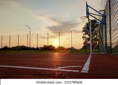 Outdoors Mini Football And Basketball Court With Ball Gate And Basket Surrounded With High Protective Fence.