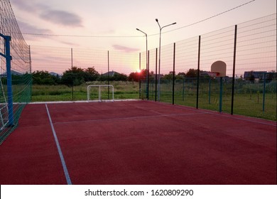 Outdoors Mini Football And Basketball Court With Ball Gate And Basket Surrounded With High Protective Fence.