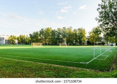 Outdoors mini football court with artificial turf. Football goal grass of a city stadium. - Powered by Shutterstock