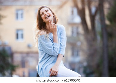 Outdoors Portrait Of Beautiful Young Girl Laughing