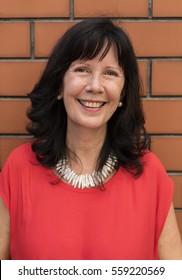 Outdoors Portrait Of A Mature Lady Smiling