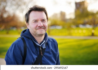 Outdoors portrait of middle age man at the spring, summer or autumn day