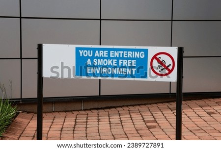 outdoors sign, no smoking,  you are entering a smoke free environment