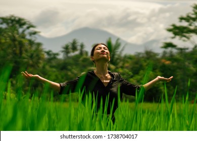 Outdoors Yoga And Meditation At Rice Field - Attractive And Happy Middle Aged Asian Japanese Woman Enjoying Yoga And Relaxation In Connection With The Nature In Healthy Lifestyle And Wellness