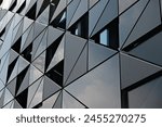 The outer covering of a building. A perspective photograph of the outer covering prepared with triangular forms, taken upwards.