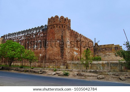 Outer view of South Bhadra Gate and wall of Champaner Fort, located in UNESCO protected Champaner - Pavagadh Archaeological Park, Gujarat