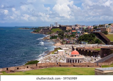 The outer walls of El Morro fort and Santa Maria Magdalena de Pazzis colonial era cemetery located in Old San Juan Puerto Rico.